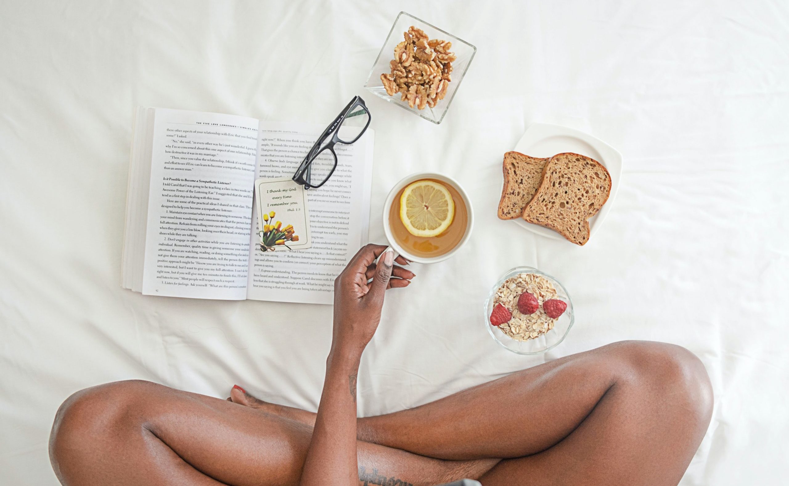 cropped-person-holding-white-ceramic-mug-with-lemon-near-book-and-1065588-scaled-2.jpg